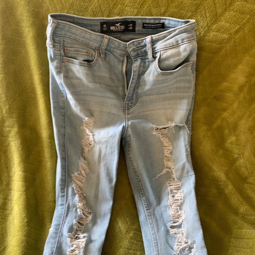 Distressed faded jeans